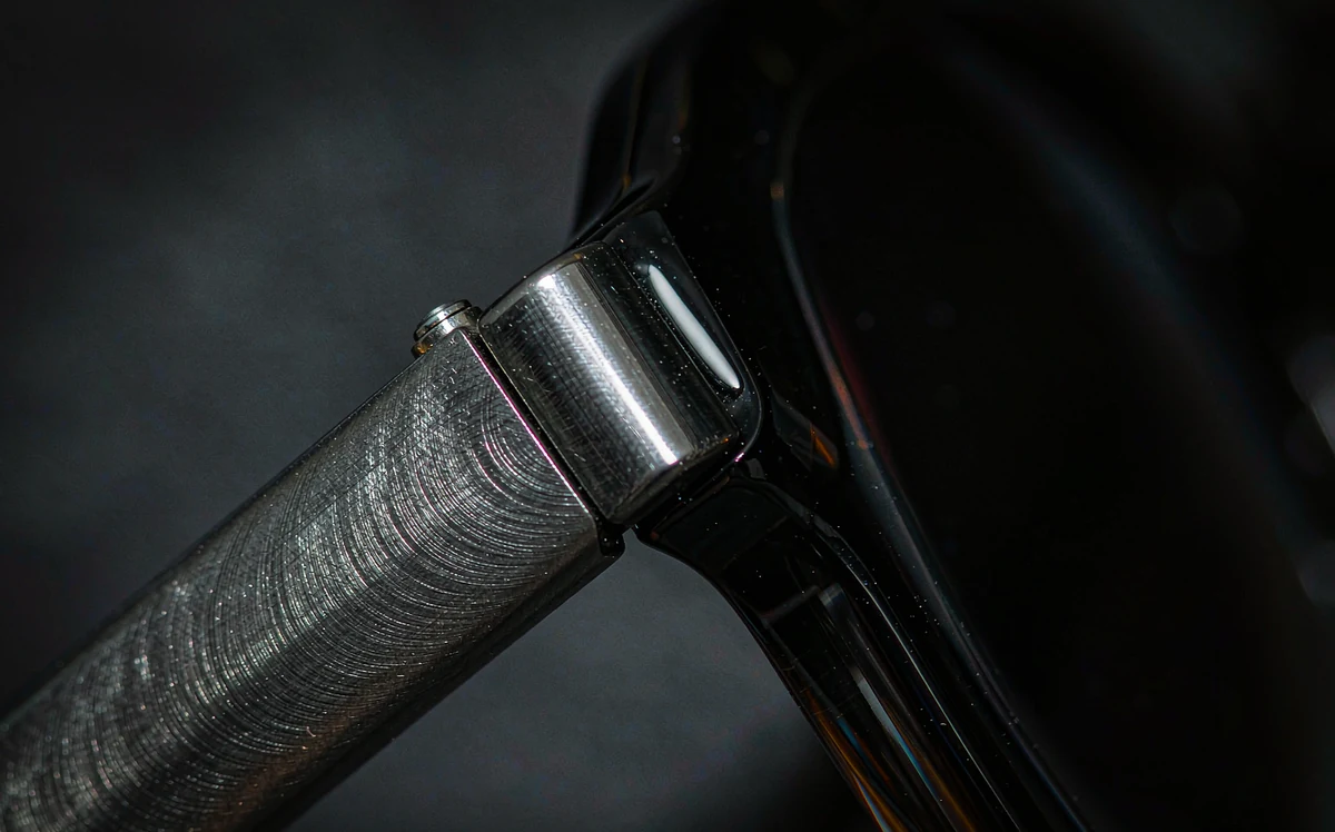 Hinge and temple detail on a sunglasses frame